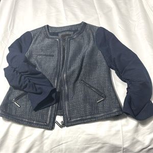 Navy blue jacket/  zipper on pockets.  Faux leather trim.  The ruched sleeves.